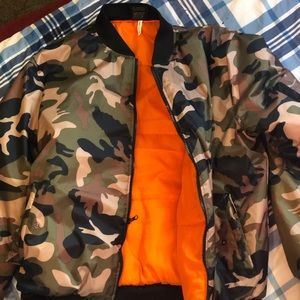 Only worn once army print and orange puffer jacket